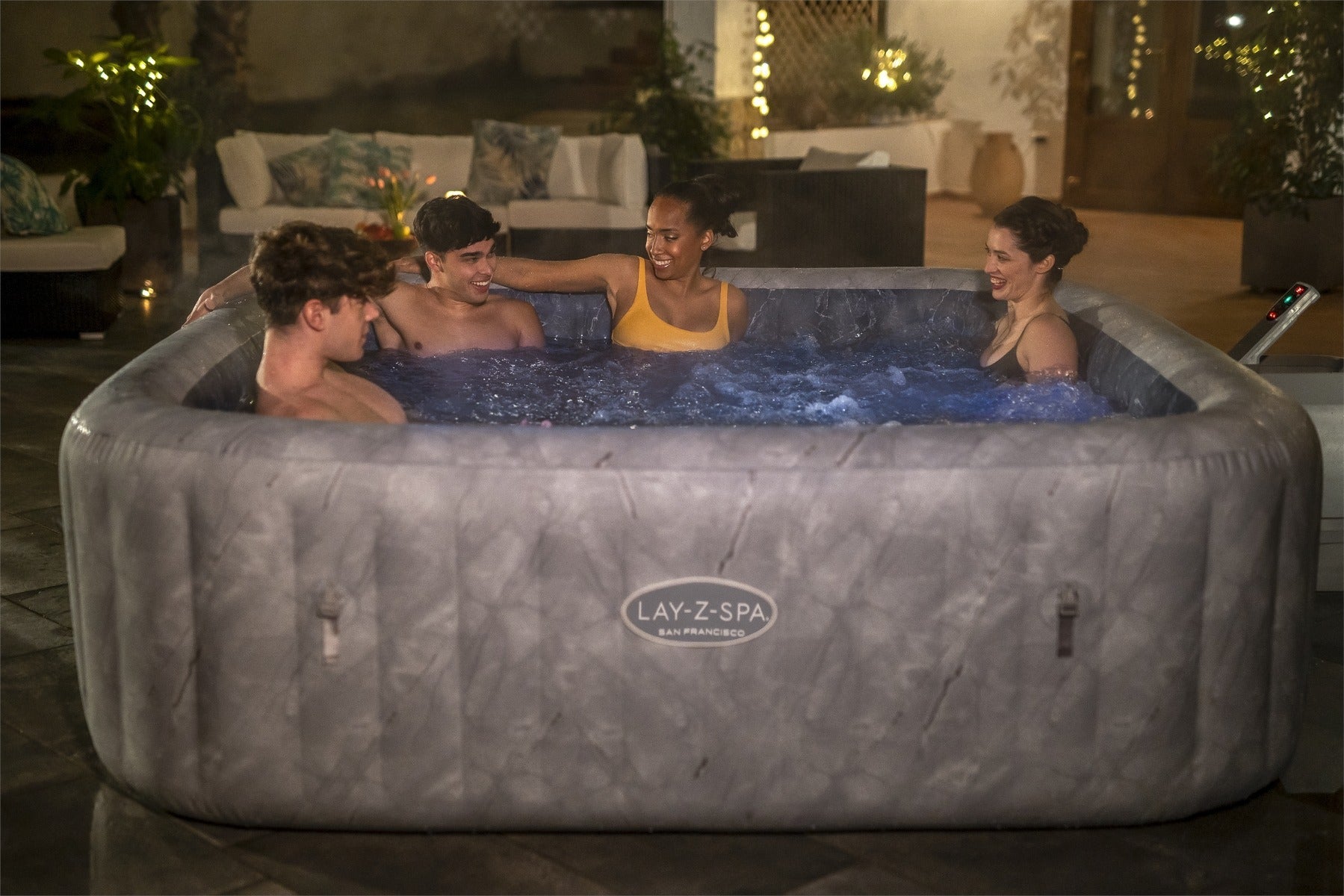 large inflatable hot tub at night with lights