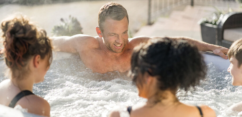 Using a portable hot tub in winter is a great way to get outdoors and enjoy the winter sun.